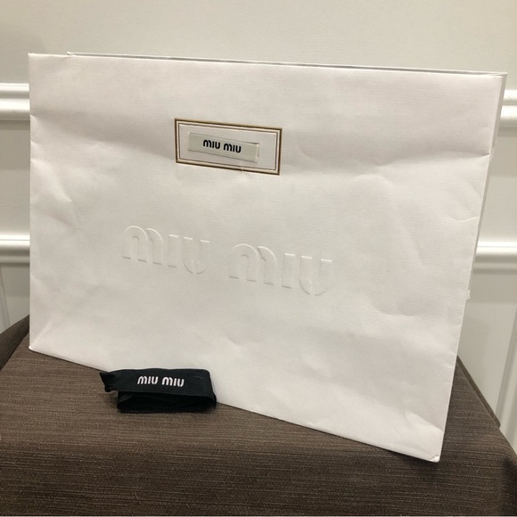 Authentic MIU MIU gift bag with MIU MIU ribbon. Very good condition. - Picture 1 of 3